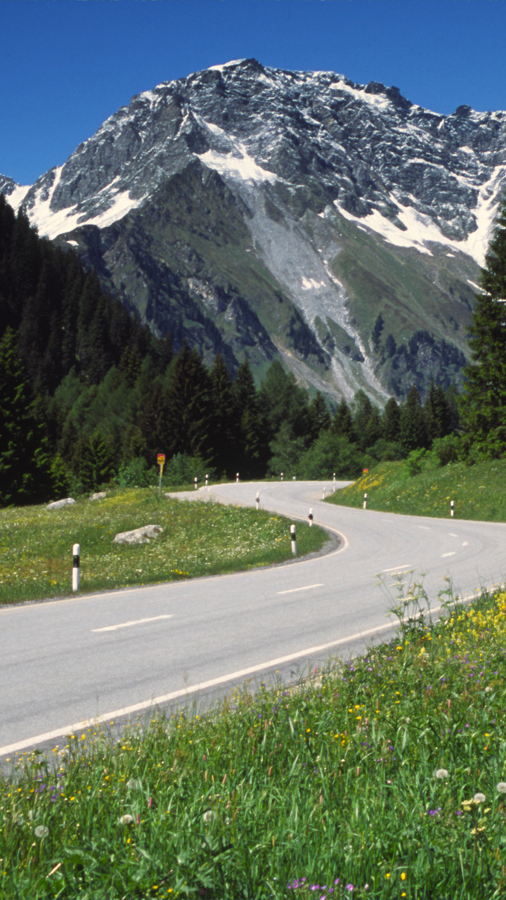 Modern touring coach, scenic European road